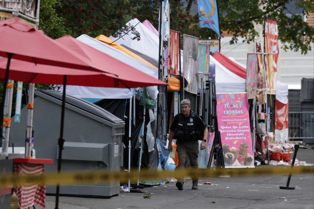 ตำรวจเข้าตรวจสอบที่เกิดเหตุกราดยิงในงานเทศกาลอาหาร Bite of Seattle ภาพ: Reuters