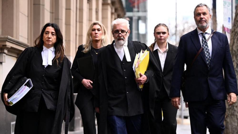 Patterson's legal team, led by Richard Edney (centre)
