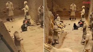 touristjumpsintoTerracottaArmyclaywarriors-02